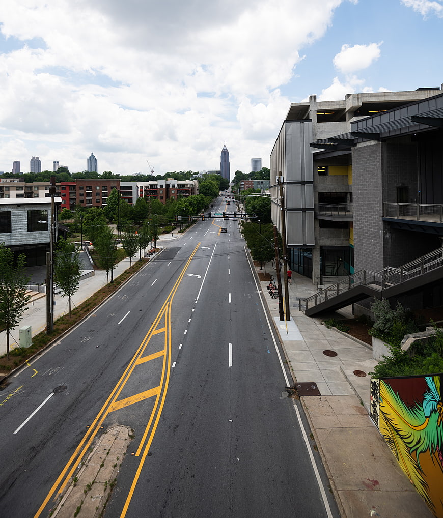 Wide Urban Street View with City Skyline and Modern Buildings
