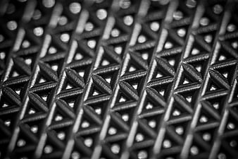 Black and white macro texture of woven mesh pattern