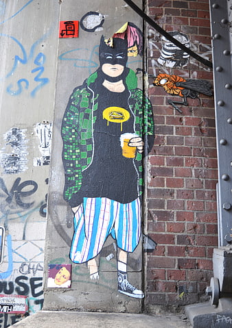 Street Art Mural of Batman Character with Beer on Urban Wall