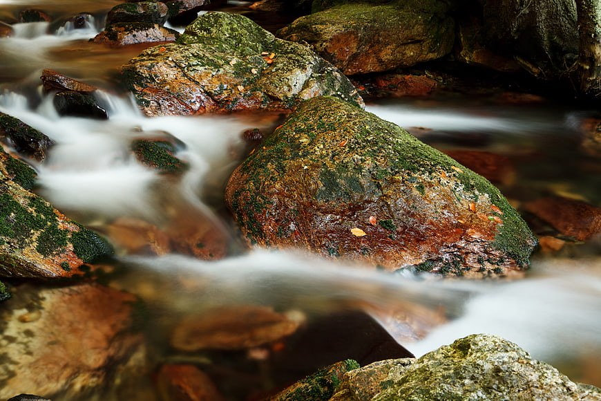 Long Exposure Mossy Rocks in Flowing Stream