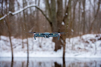 Drone Flying in Snowy Winter Forest Landscape