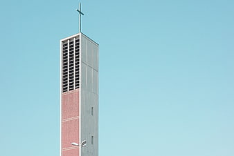 Modern Church Bell Tower Against Blue Sky