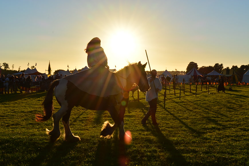 Silhouette of Horse Rider at Medieval Festival Sunset