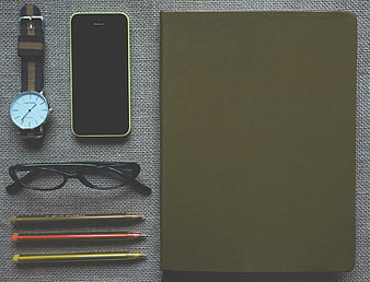 Flat Lay Workspace With Notebook, Smartphone, Watch, Glasses And Pens