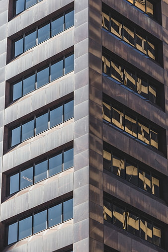 Modern Office Building Corner with Geometric Window Patterns