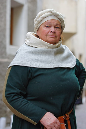 Portrait of elderly woman in medieval costume