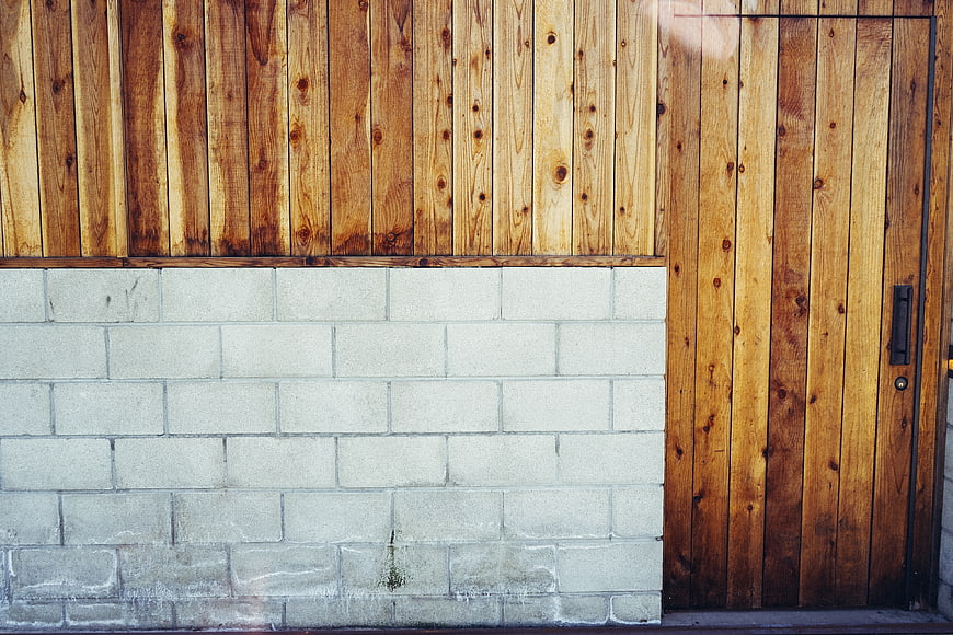 Modern wooden door and concrete block wall texture