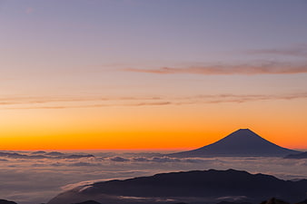 Mount Fuji Silhouette Over Sea of Clouds at Sunrise
