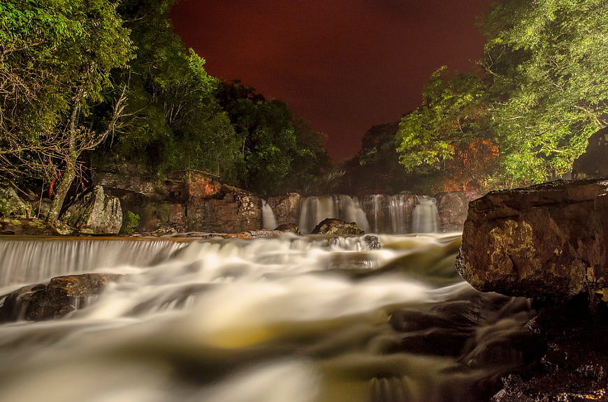 Long Exposure Night Waterfall in Lush Forest
