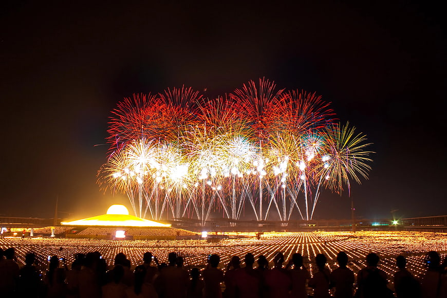Spectacular Fireworks Display Over Stadium Crowd at Night
