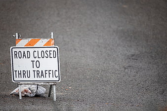 Road Closed to Thru Traffic Sign on Asphalt