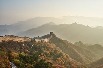 Great Wall of China winding through autumn mountains