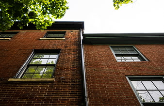 Low Angle View of Red Brick Building Facade with Windows