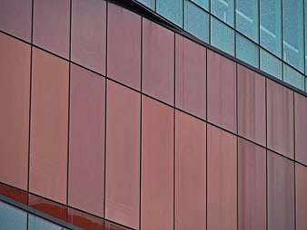 Abstract modern building facade with pink and blue panels
