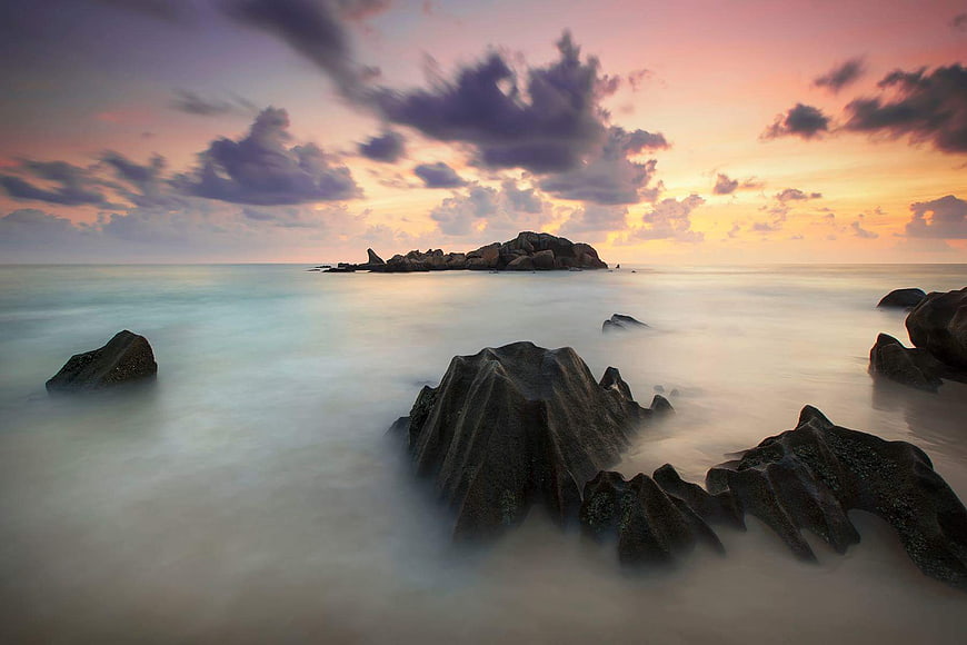 Long Exposure Sunset Over Rocky Ocean Coastline