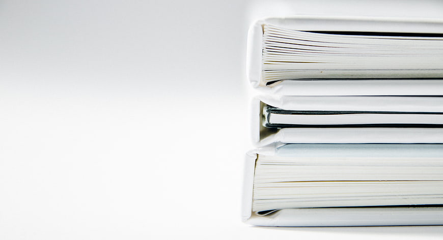 Minimalist Stack of White Books on White Background