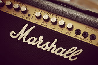 Close-up of Marshall guitar amplifier control panel and logo