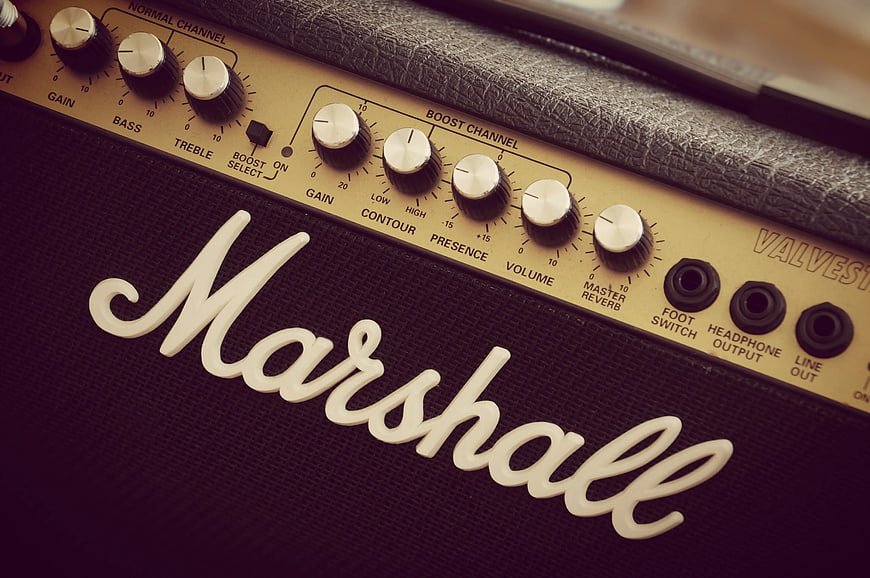 Close-up of Marshall guitar amplifier control panel and logo
