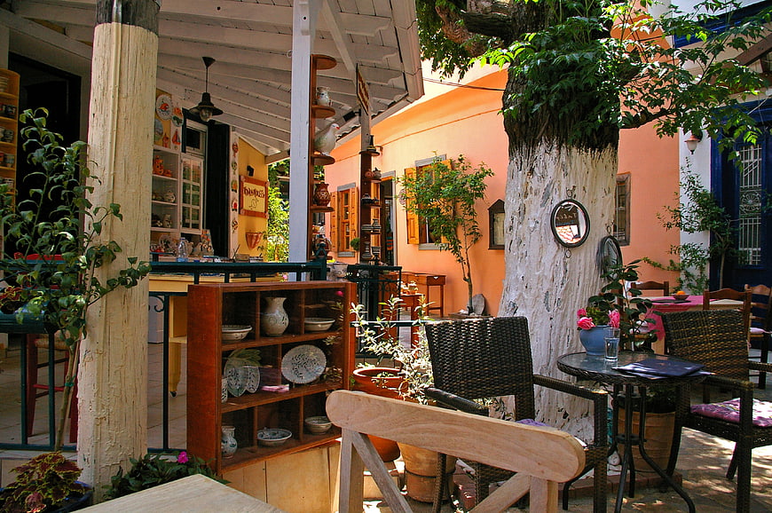 Rustic Mediterranean Courtyard Cafe with Terracotta Walls and Greenery