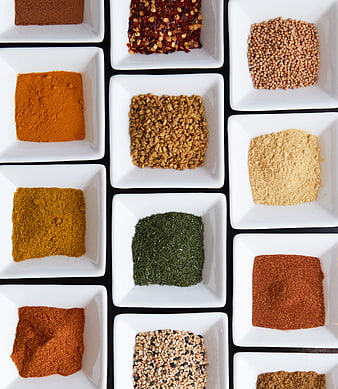Top View of Various Spices in White Square Bowls