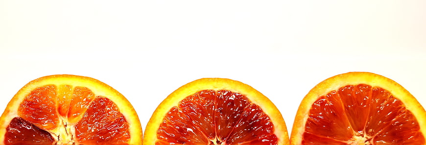 Sliced Blood Oranges on White Background