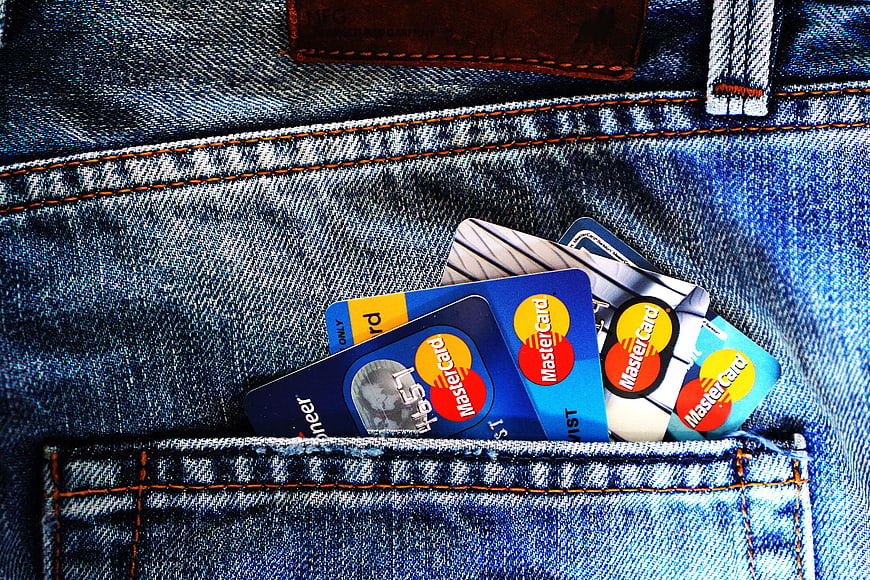 Mastercard credit cards in blue denim jeans pocket