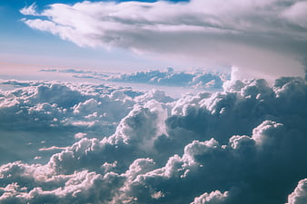 Aerial View of Fluffy Cumulus Clouds in Blue Sky