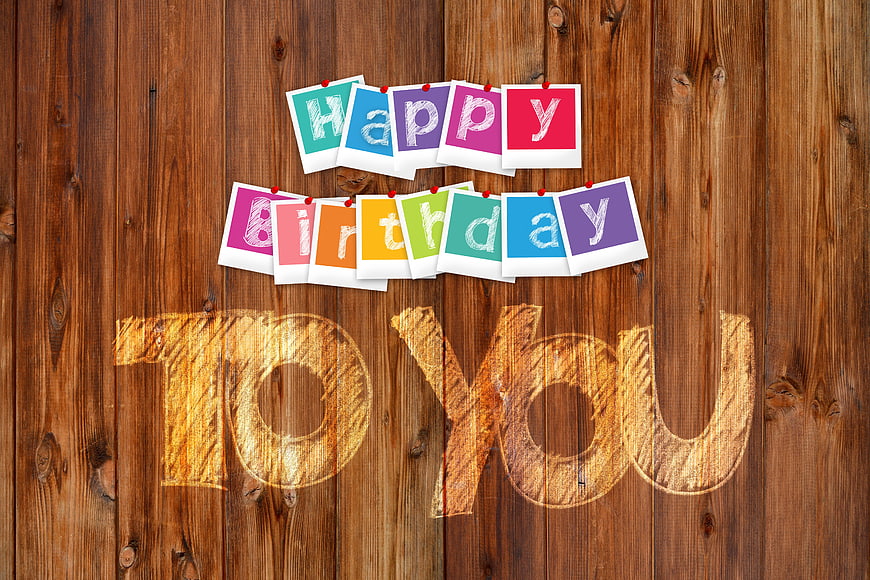 Happy Birthday Greeting on Wooden Background with Polaroids