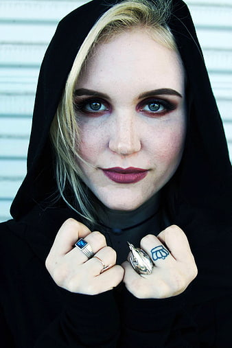 Blonde Woman in Black Hoodie with Dark Makeup and Rings
