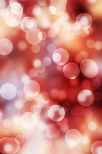 Abstract Red and Pink Bokeh Background with Soft Light Circles
