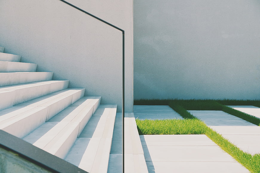 Minimalist Concrete Staircase with Green Grass