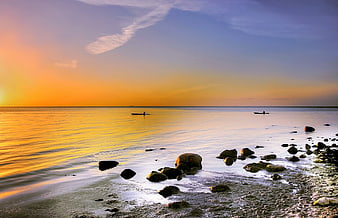 Serene Sunset Seascape with Kayaks on Calm Ocean
