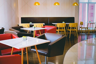 Modern Cafe Interior with Colorful Chairs and Marble Tables