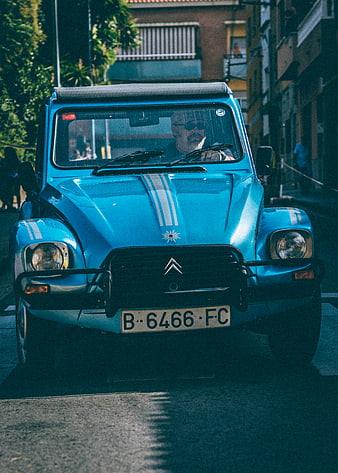 Vintage Blue Citroën Méhari Driving on Street