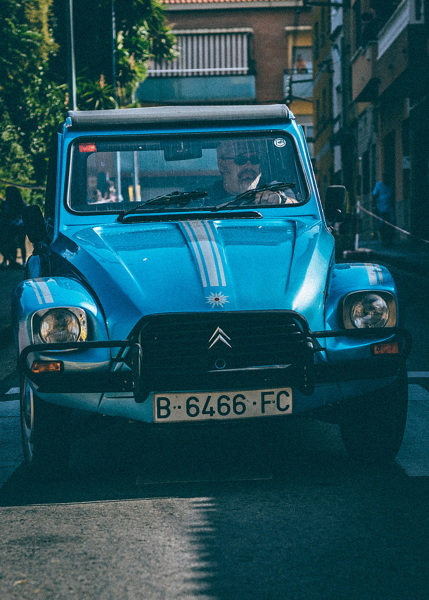 Vintage Blue Citroën Méhari Driving on Street