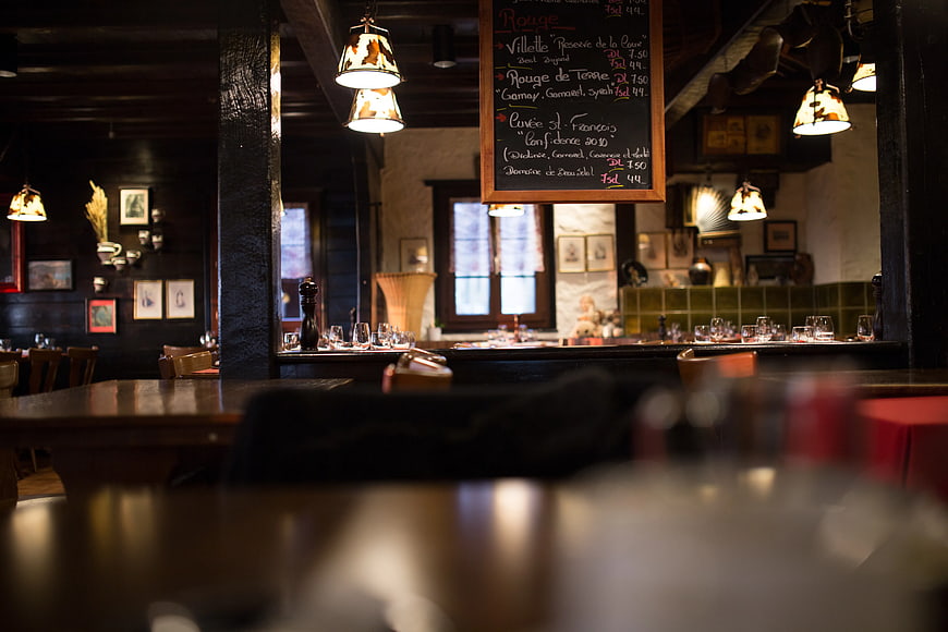 Rustic French Bistro Interior with Hanging Chalkboard Menu