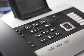Close-up of office telephone keypad and buttons