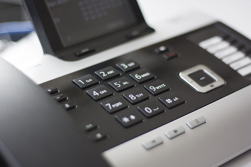 Close-up of office telephone keypad and buttons