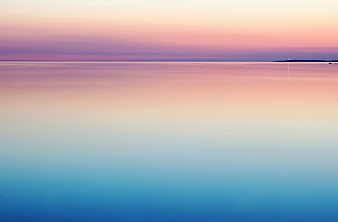 Minimalist pastel sunset seascape with smooth water gradient