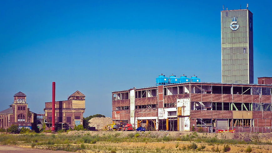 Abandoned Industrial Complex with Blue Tanks and Tower