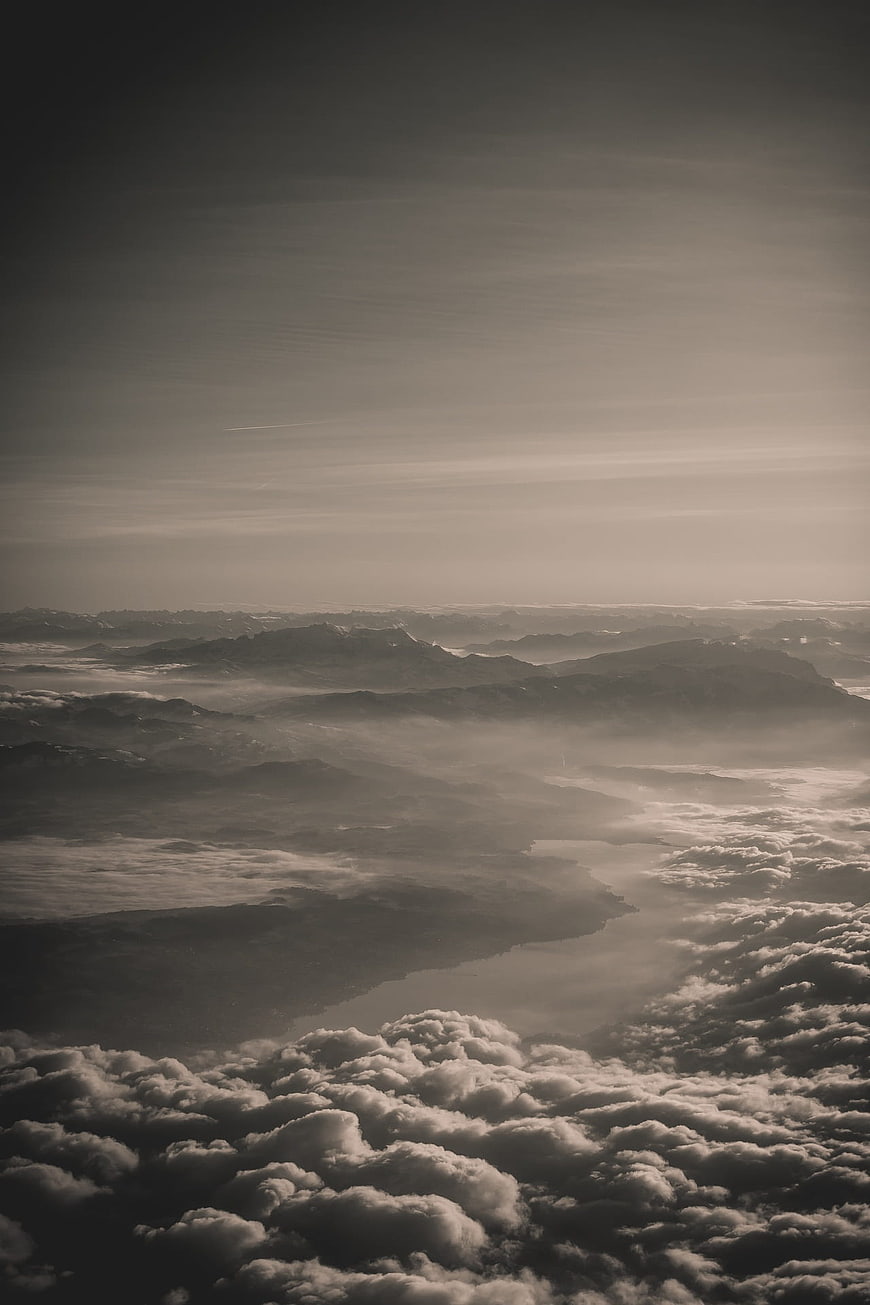 Aerial View of Mountains and Clouds in Sepia Tone