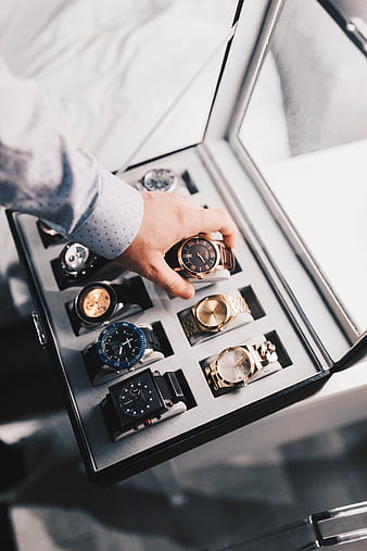 Man Selecting Luxury Watch from Collection Box
