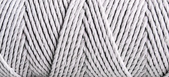Close-up texture of white twisted cotton yarn fibers