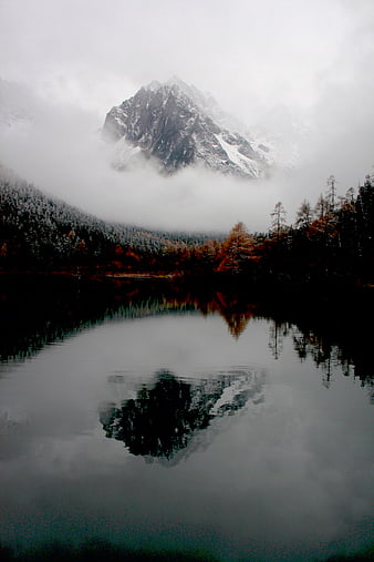Misty Mountain Peak Reflected in Dark Lake