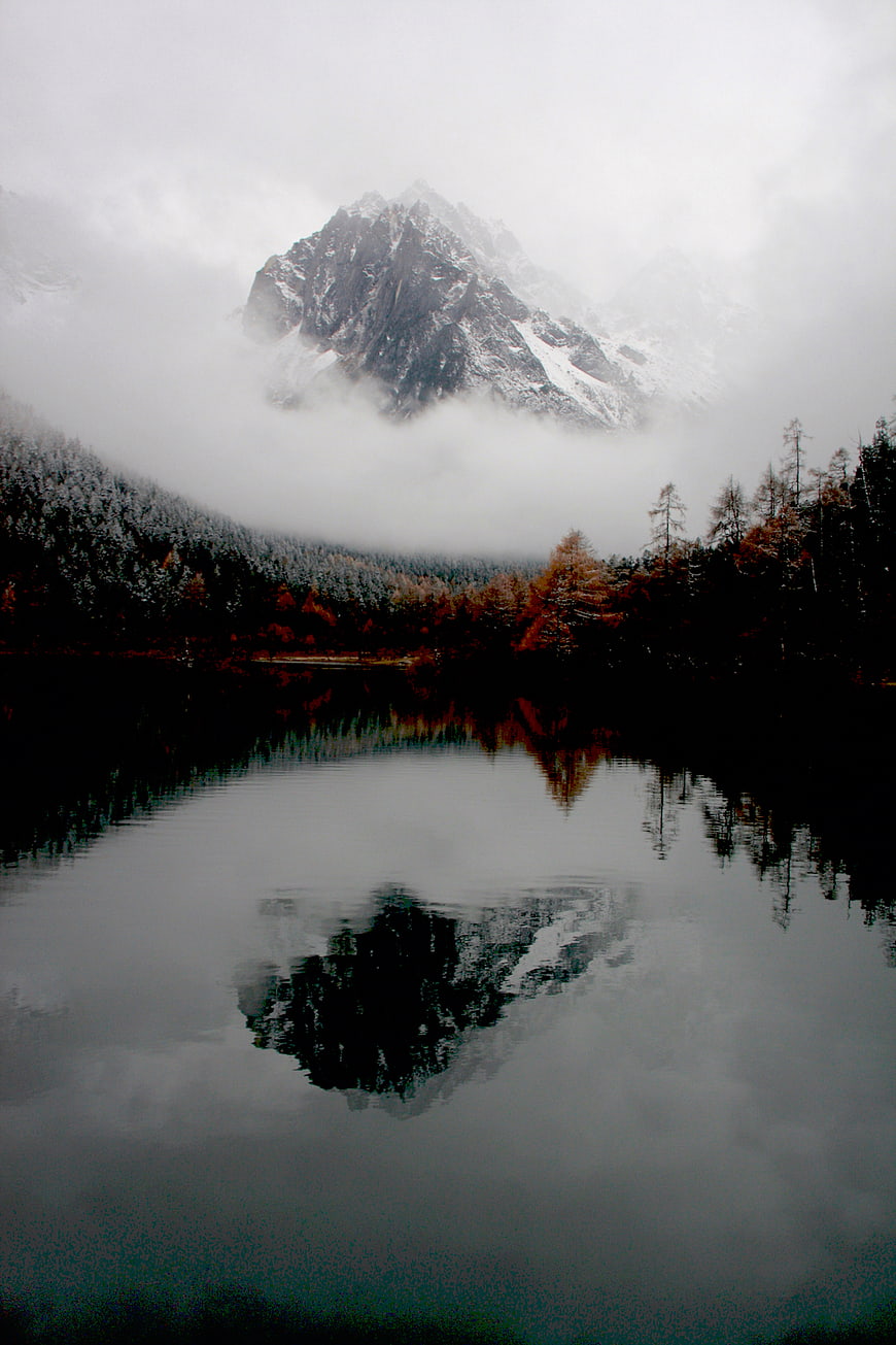 Misty Mountain Peak Reflected in Dark Lake