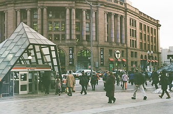 Pedestrians walking near South Station Boston entrance