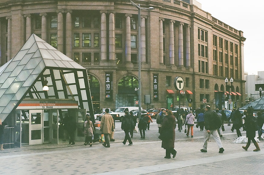 Pedestrians walking near South Station Boston entrance