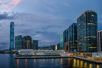 Hong Kong Skyline at Dusk with Skyscrapers and Water Reflections