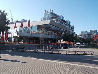 Modern urban plaza with restaurant and bike racks