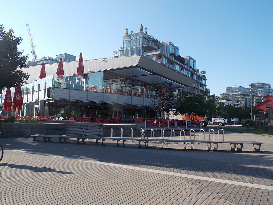 Modern urban plaza with restaurant and bike racks